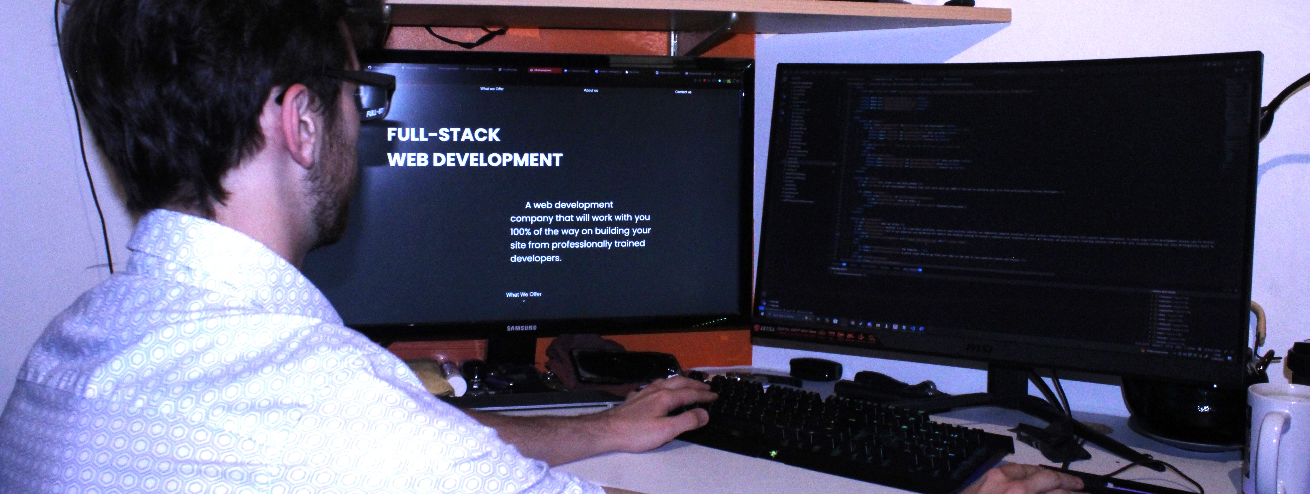 An image of a man working at a desk on the CR Web Development site